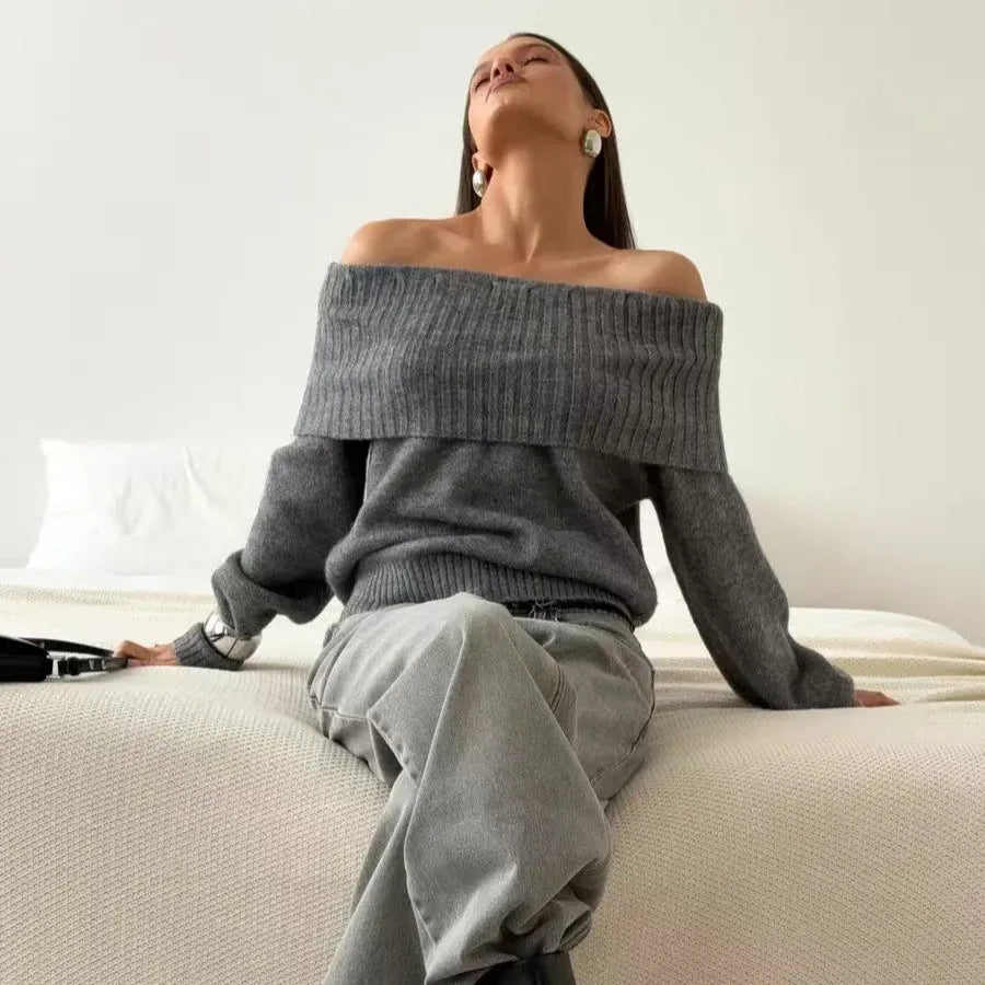 Grey strapless off-the-shoulder acrylic sweater with a 3D pattern, shown as a pullover.