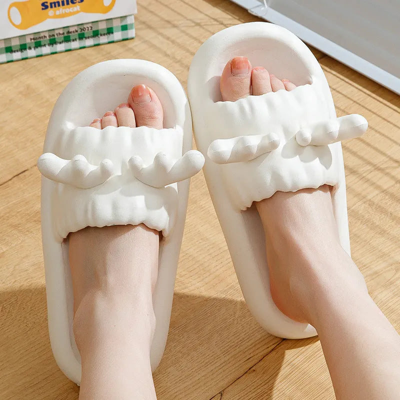 Women's deer horn design EVA flip flop slippers in light yellow colour on a white background.
