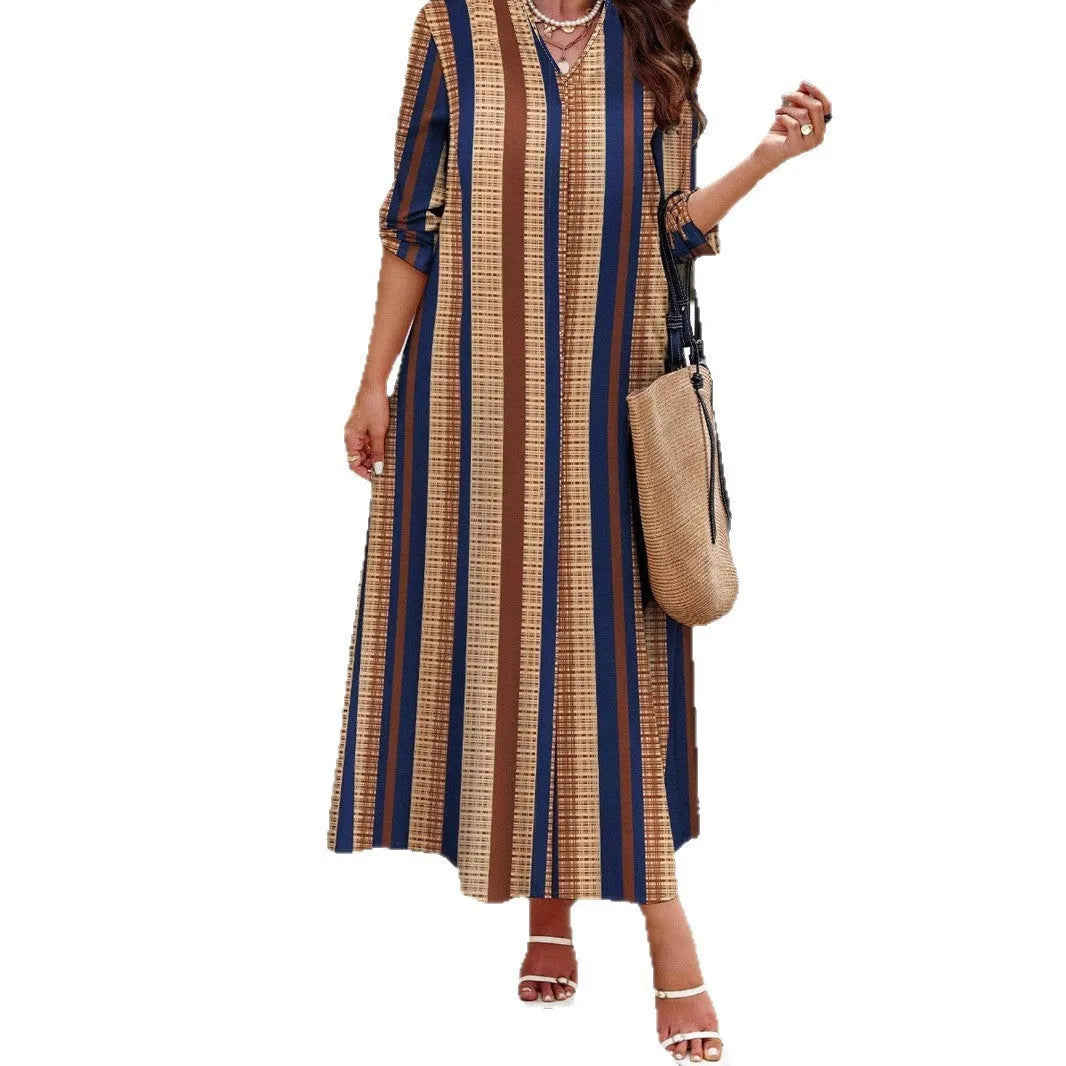 Camel-colour women's knitted V-neck dress with vertical stripes and long A-line skirt.