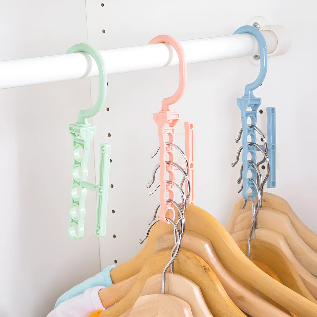Blue magic revolving wardrobe hanger with five holes and a central handle on a white background.