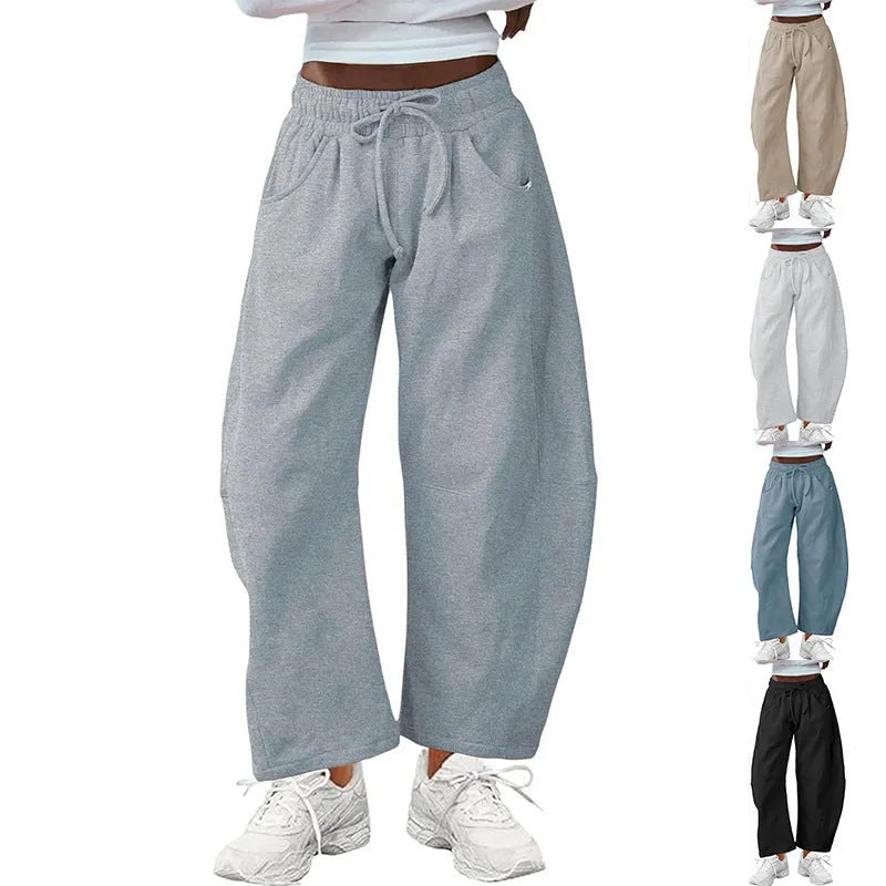 Women's loose cropped sweatpants with elastic waist and drawstring pockets in street fashion style