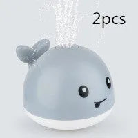Automatic water spray whale bath toy with lights floating in baby bath