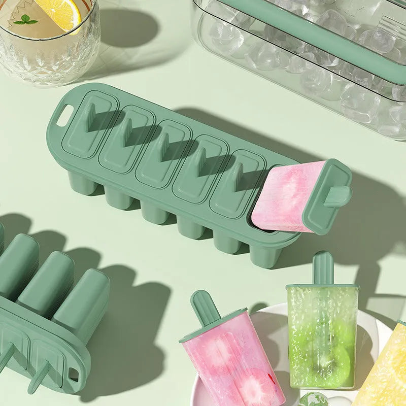 Green portable popsicle mold made from PP PET materials measuring 23.4 cm tall