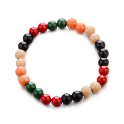 Natural stone beaded bracelet with lava stone charms on wrist, showing ethnic design and 18cm unisex fit.
