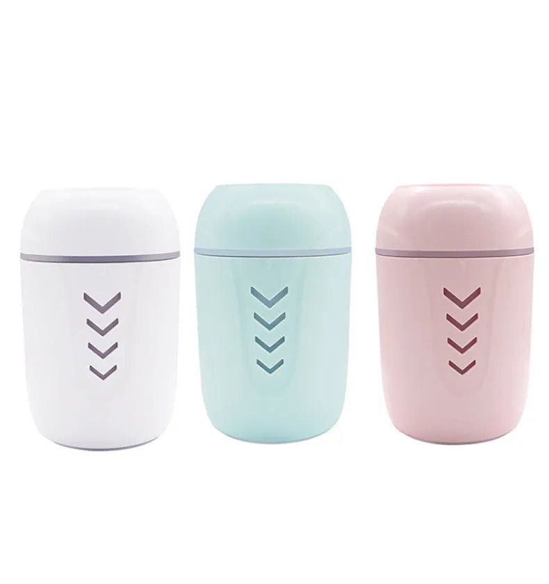 Portable columnar humidifier with 200ml capacity in blue, pink, or white colours showing USB and AC power options