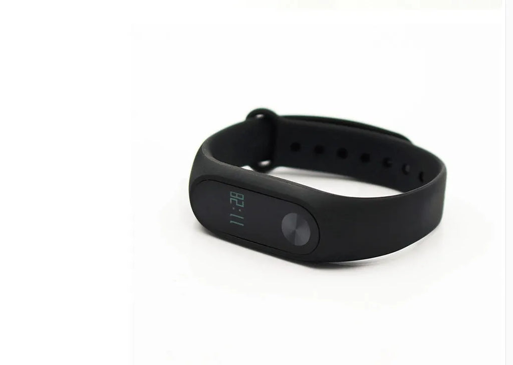 Black Xiaomi Mi Band 2 fitness tracker with OLED screen on an adjustable wrist strap