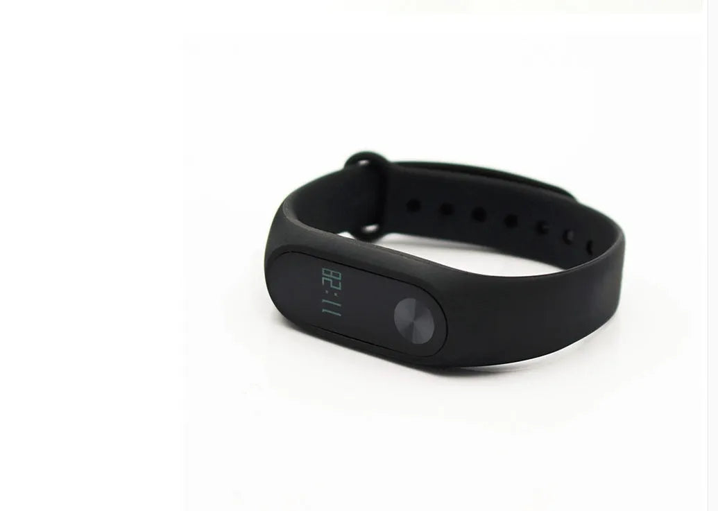 Black Xiaomi Mi Band 2 fitness tracker with OLED screen on an adjustable wrist strap
