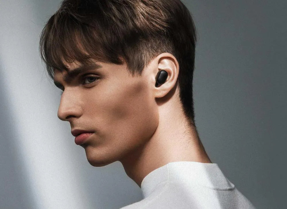 Redmi AirDots black true wireless Bluetooth headphones with charging case.