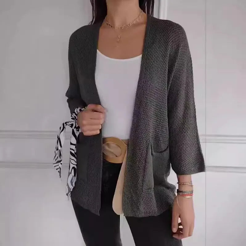 Women's waffle knit cardigan coat with nine-quarter length sleeves and pockets in army green.