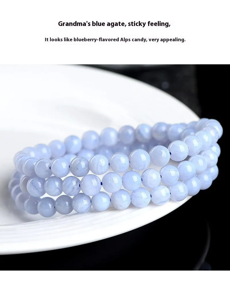 Blue agate bracelet with patterned ball and striped scattered beads showing three-circle construction