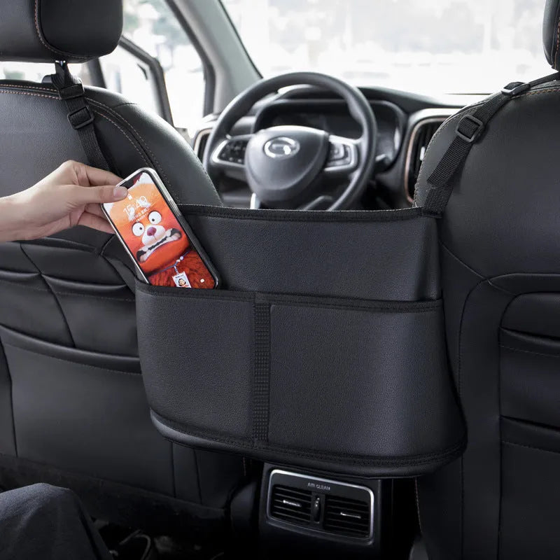 Black leather car seat storage bag with carbon fibre pattern measuring 38cm for centre console organisation