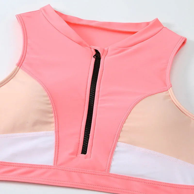 Pink high waist bikini swimsuit with side splits and briefs style on a mannequin
