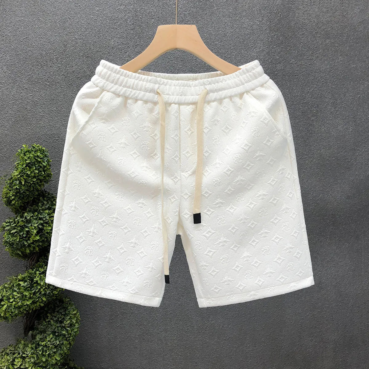 White jacquard shorts for men with straight cut and micro elastic fabric, displayed on a model