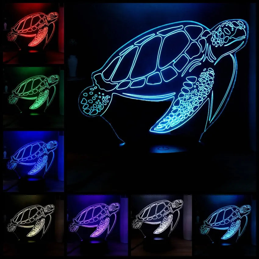 3D acrylic turtle-shaped LED night light with multi-colour glow on a surface.