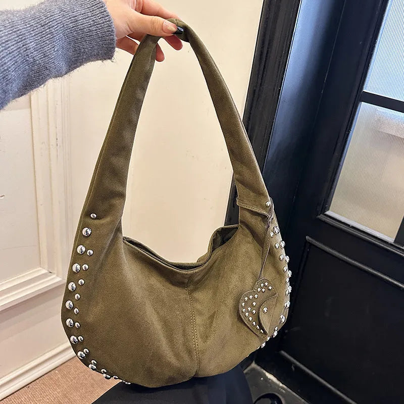 Women's soft plush underarm tote handbag in retro styling showing black, red, brown and green colour options