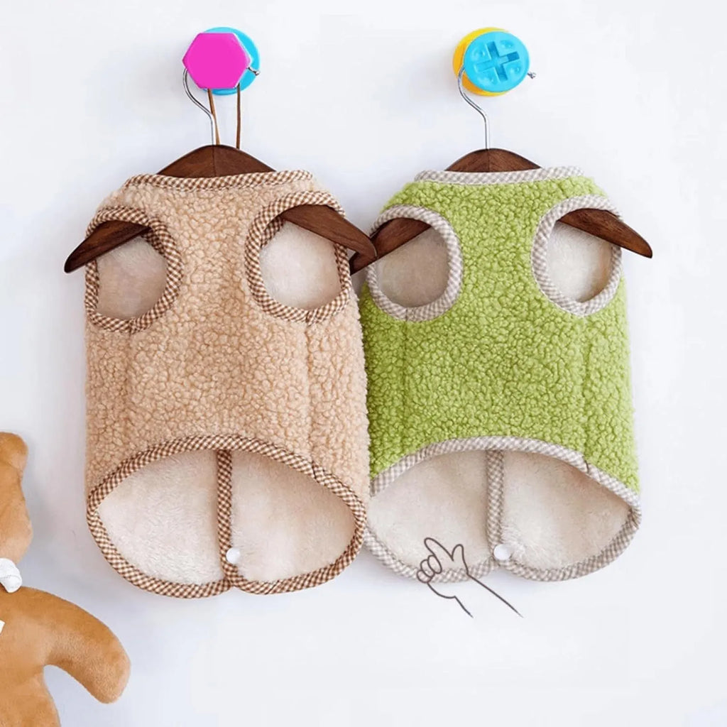 Green coral fleece dog vest with leash ring on small dog during autumn