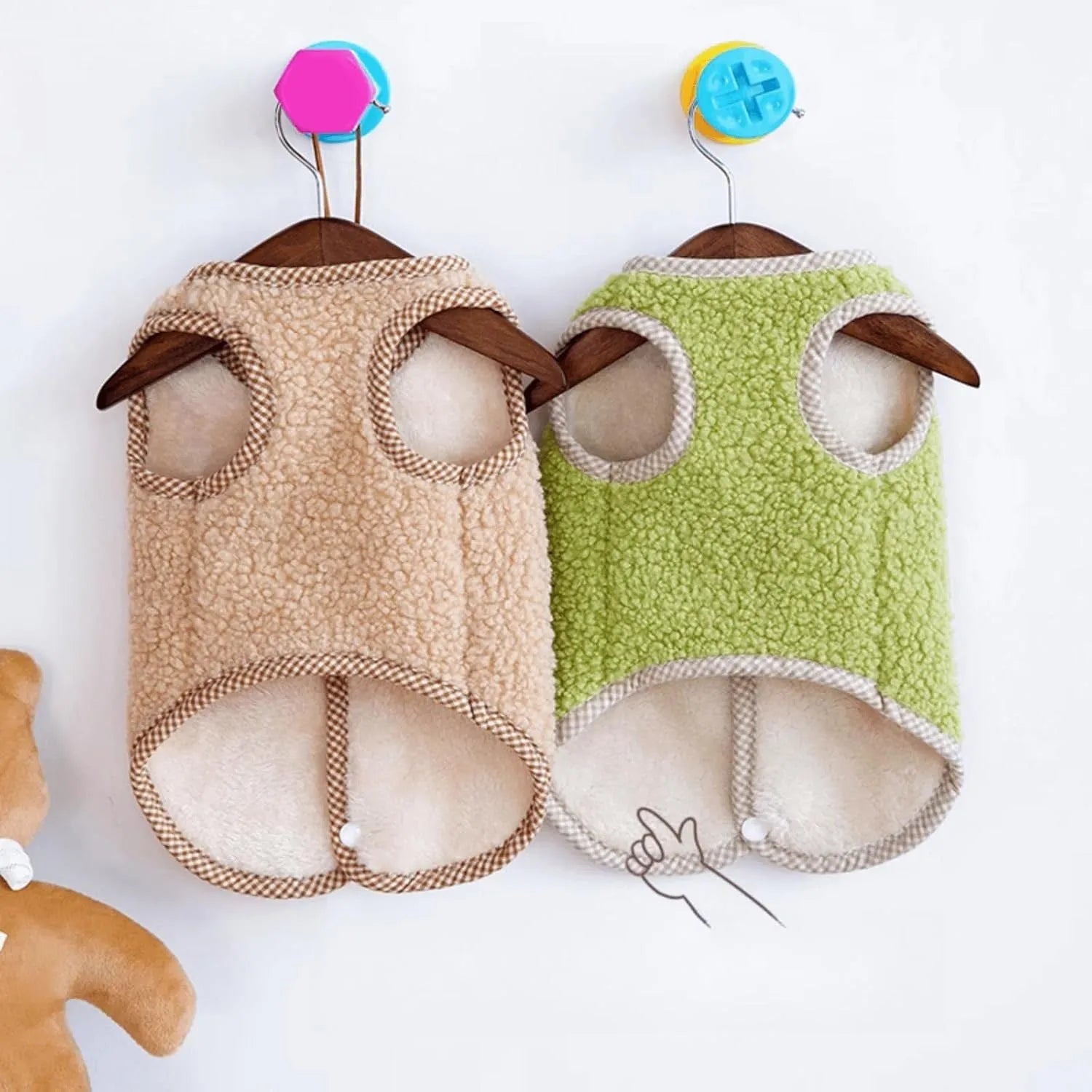 Green coral fleece dog vest with leash ring on small dog during autumn