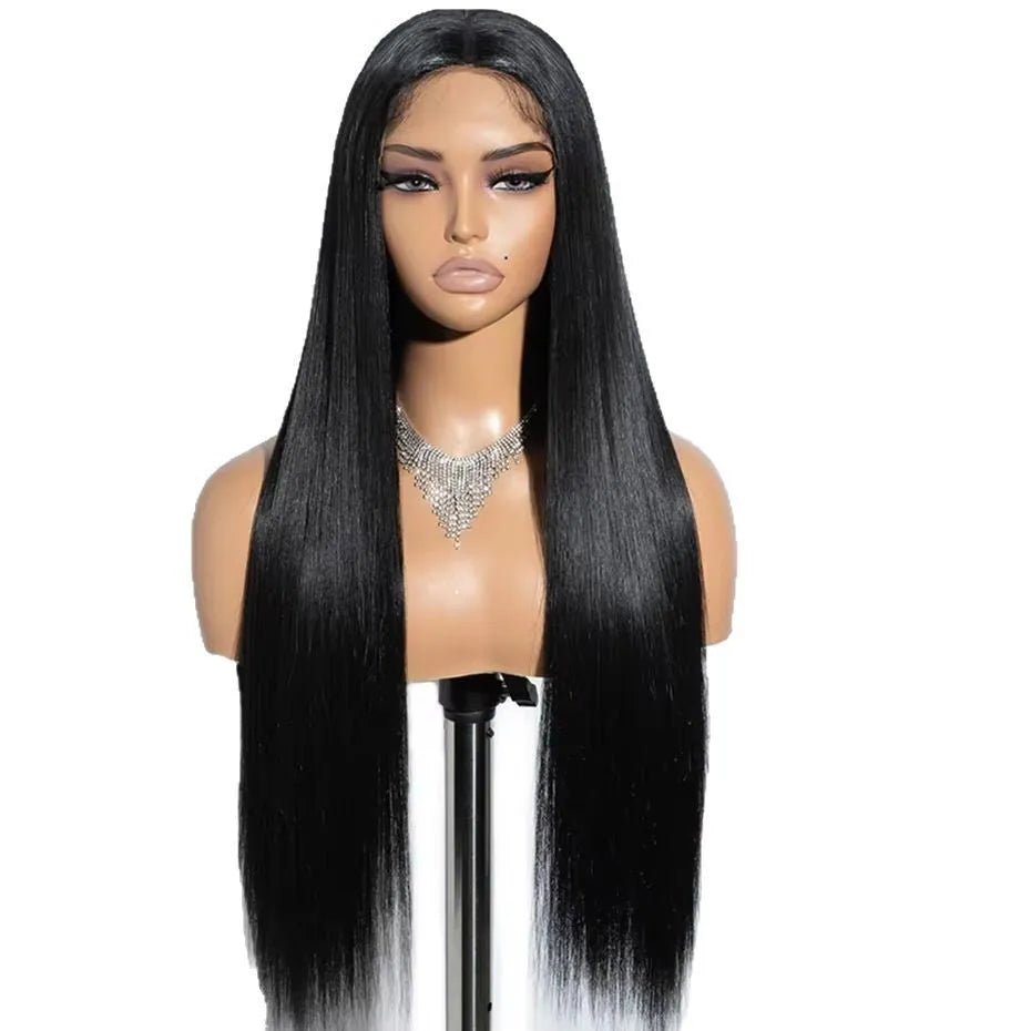 A woman wearing a long, straight black human hair glueless wig with side bangs.