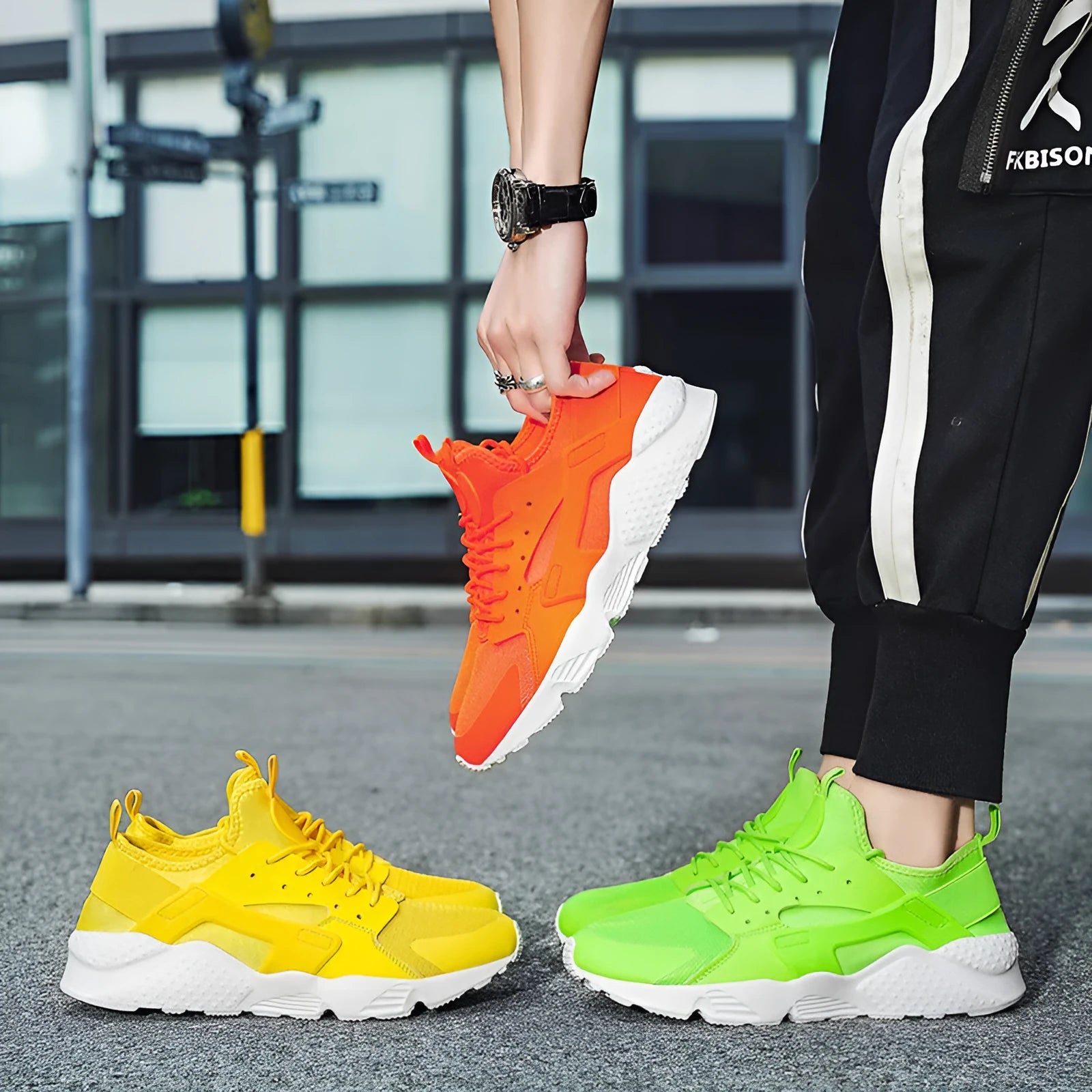 Men's green low top casual mesh shoes with cross shoulder straps and flat sole.