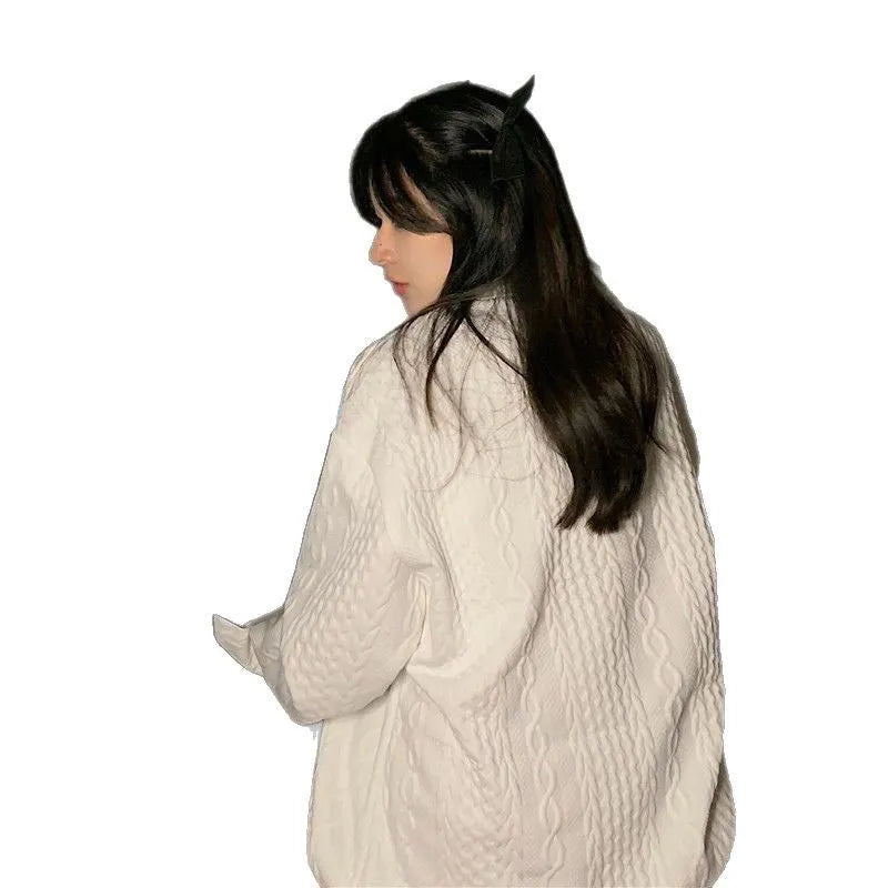 Solid white loose fit long sleeve polyester top coat with 3D pattern detail, front view