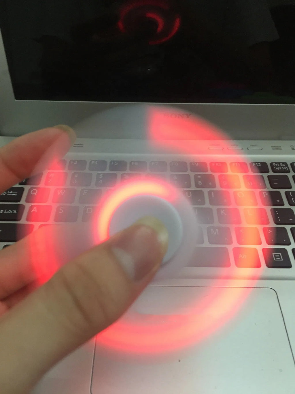Bluetooth speaker music fidget spinner EDC toy in white, showing portable ABS build