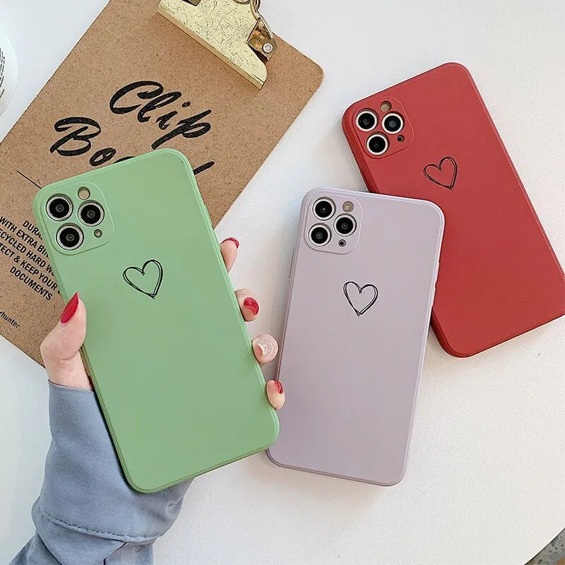 Solid colour silicone TPU phone case for Apple iPhone on a table.
