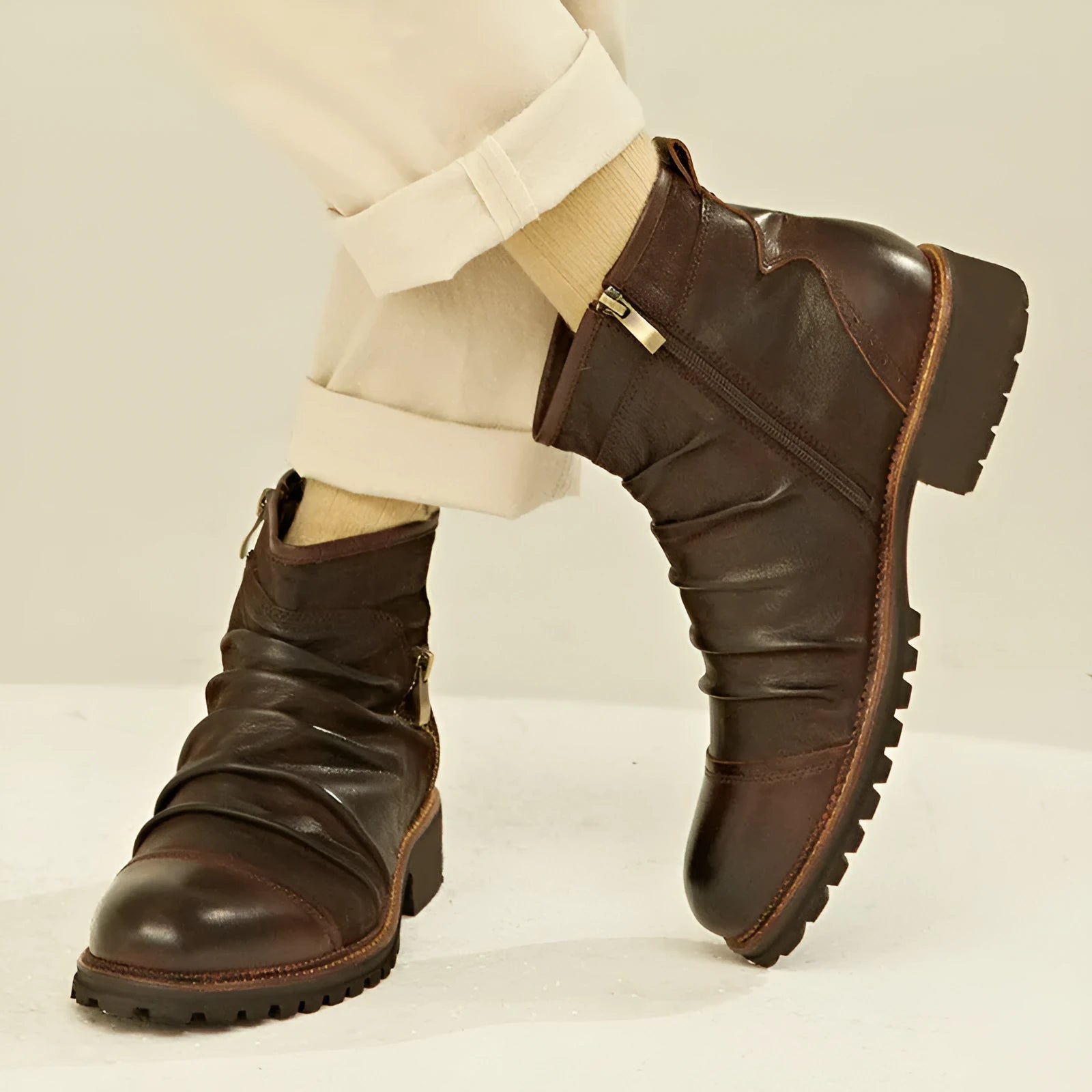 Black PU leather cowboy boots with a side zipper, horseshoe heel, and round toe on a white background.