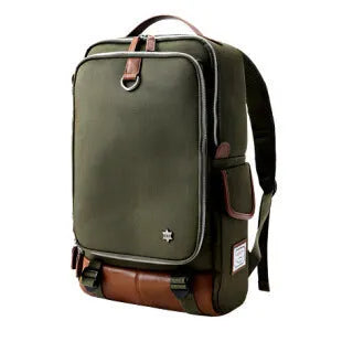 Large grey Korean-style backpack made of Oxford cloth, shown next to a laptop for scale.