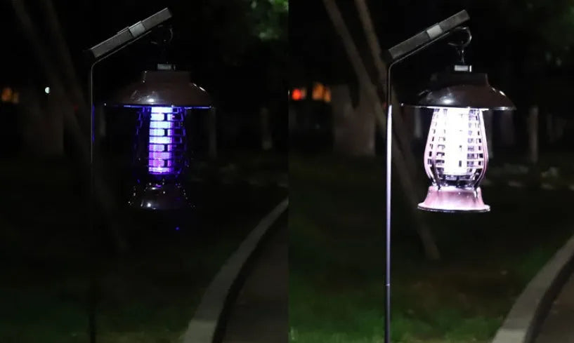 White and purple solar-powered electronic mosquito lamp for outdoor garden use.