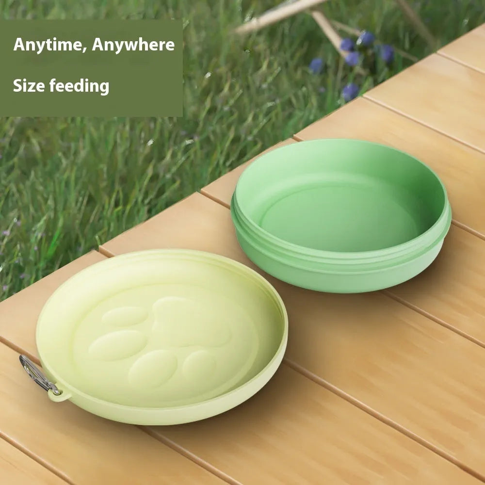 Portable plastic dog food bowl with separate snack compartment in light pink colour.