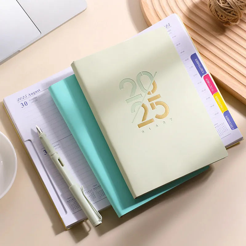 A5 daily planner notebook with faux leather cover open on a desk