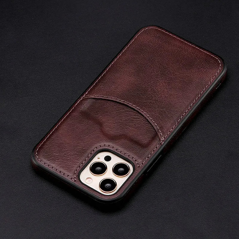 Dark blue PU leather protective phone case for iPhone on a table.