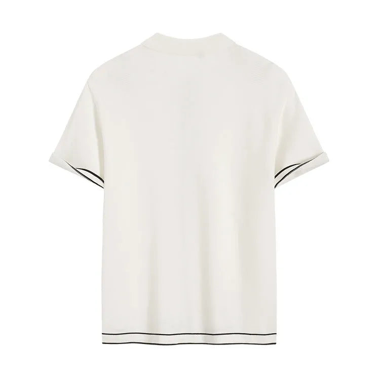 White women's short sleeve cardigan with dark contrast lapels laid flat