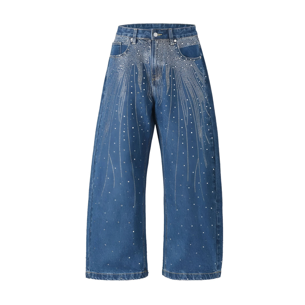 Blue loose-fitting wide-leg cotton trousers on a hanger, showing the relaxed silhouette.
