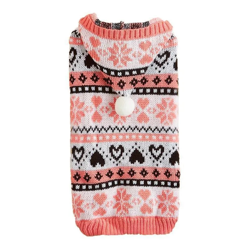 Blue knitted dog sweater with snowflake, love heart, and striped camouflage pattern on a small dog.