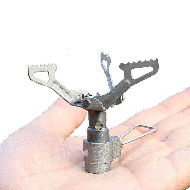 Portable propane camping stove with a one-piece metal furnace body.