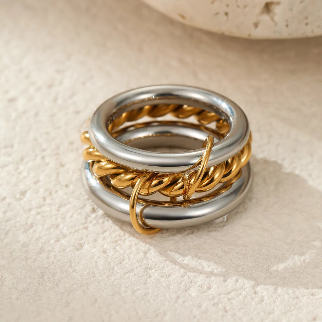 Gold plated stainless steel stacked ring set for women in an exaggerated design.