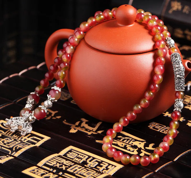 Natural watermelon crystal Chinese knot bracelet with elephant-style beads