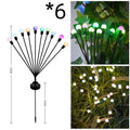 Solar-powered LED firefly ground lights with stainless steel stake for garden installation