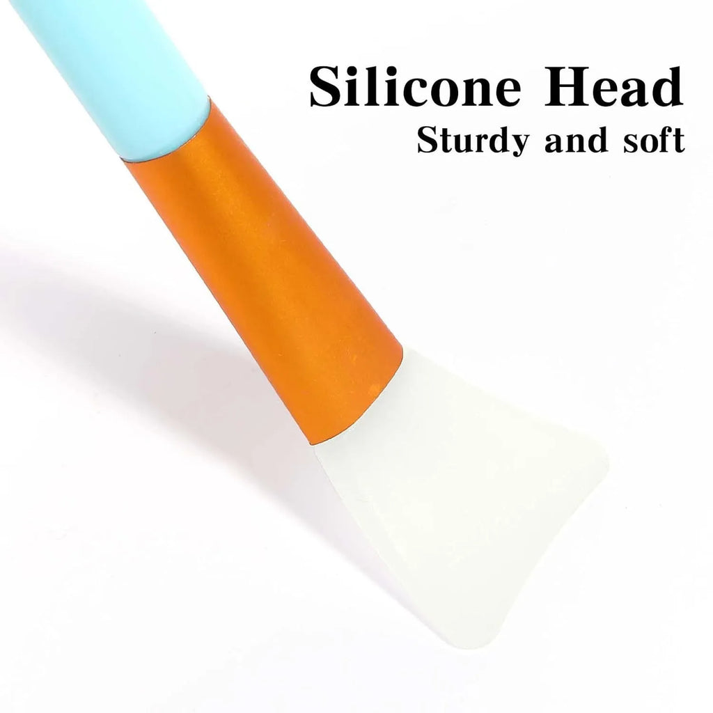 Reusable silicone spatula applicator for face and body masks in six colour options on a plain background.