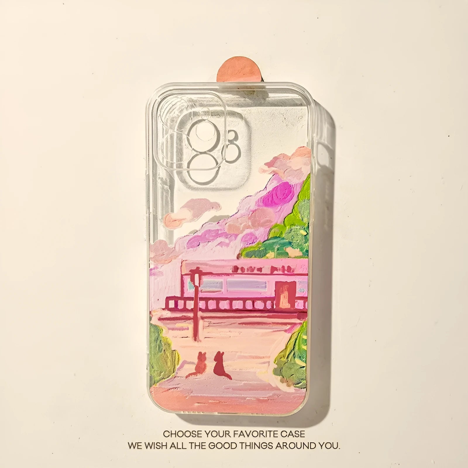 Soft silicone iPhone case with a colourful cartoon graphic of two cats on the back.