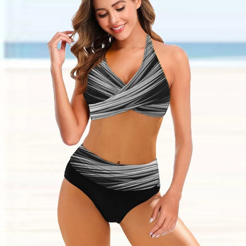 Ladies striped tie-dye bikini set with hollow details and high-waisted briefs on a model.