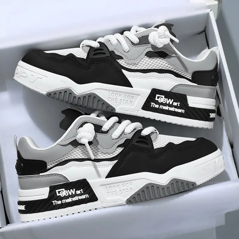 Men's low-top white board shoes with a soft rubber sole and mesh lining
