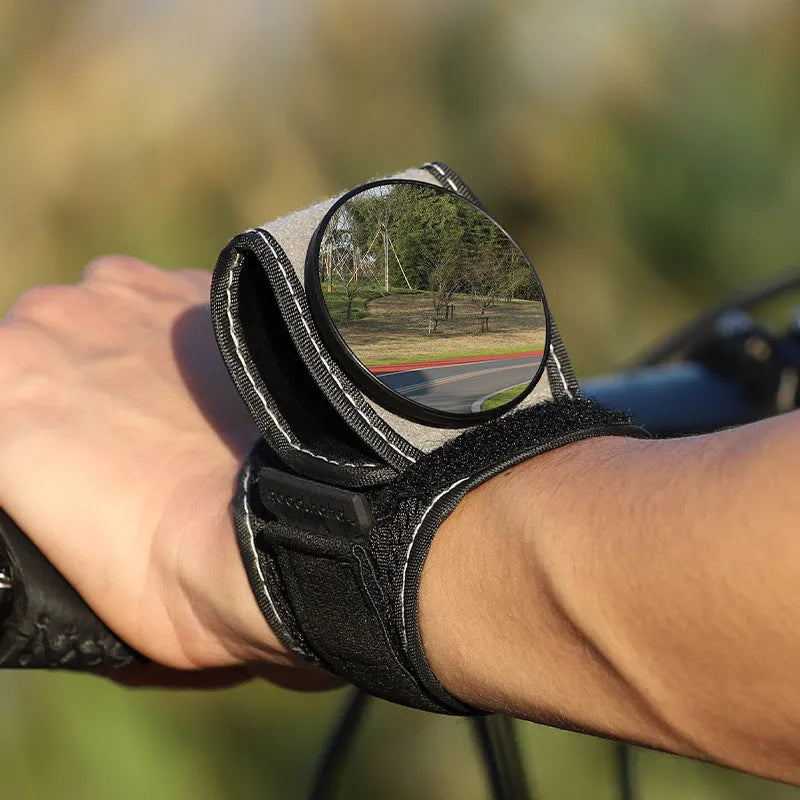 Black nylon wrist-mounted bicycle rear-view mirror with adjustable strap