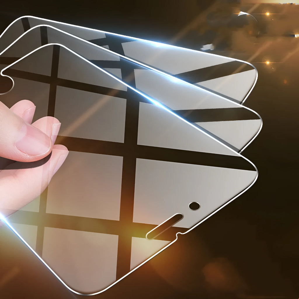 Tempered glass screen protector for iPhone models on a clean surface.