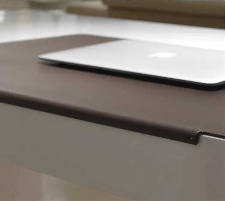 Large black PVC computer desk mat 700x450x3mm with non-slip base on a wooden desk