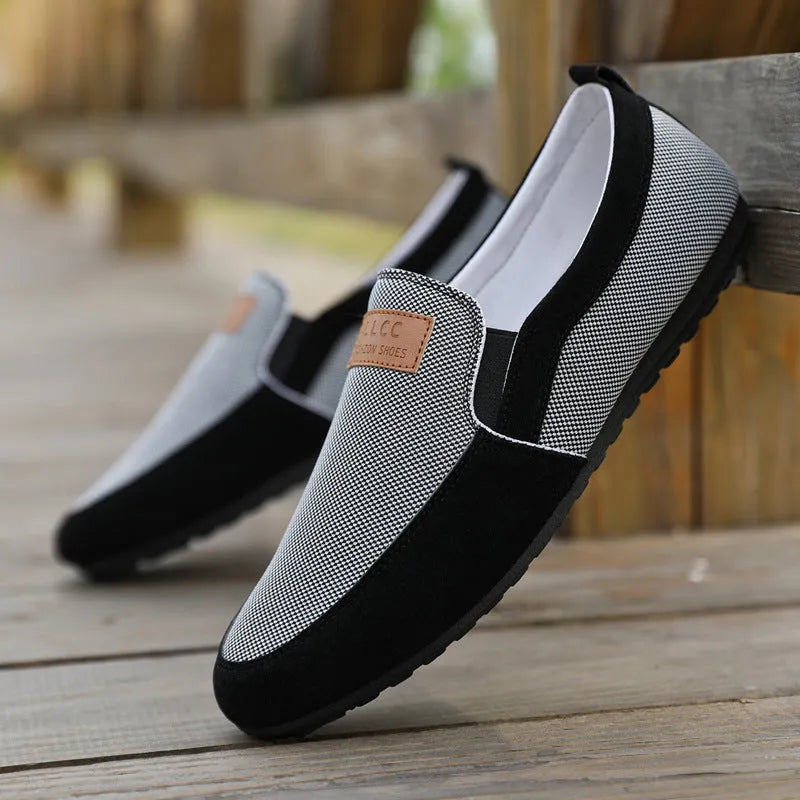 Men's grey and khaki canvas casual shoes with round toe and stitching detail.