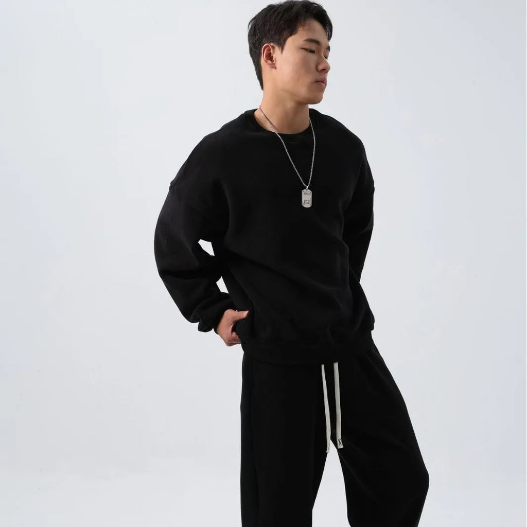 Men's loose fit polar fleece sports suit in army green, showing jacket and trousers.
