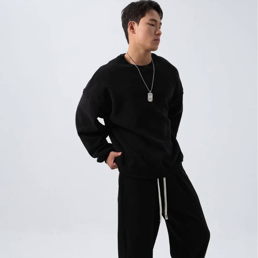Men's loose fit polar fleece sports suit in army green, showing jacket and trousers.