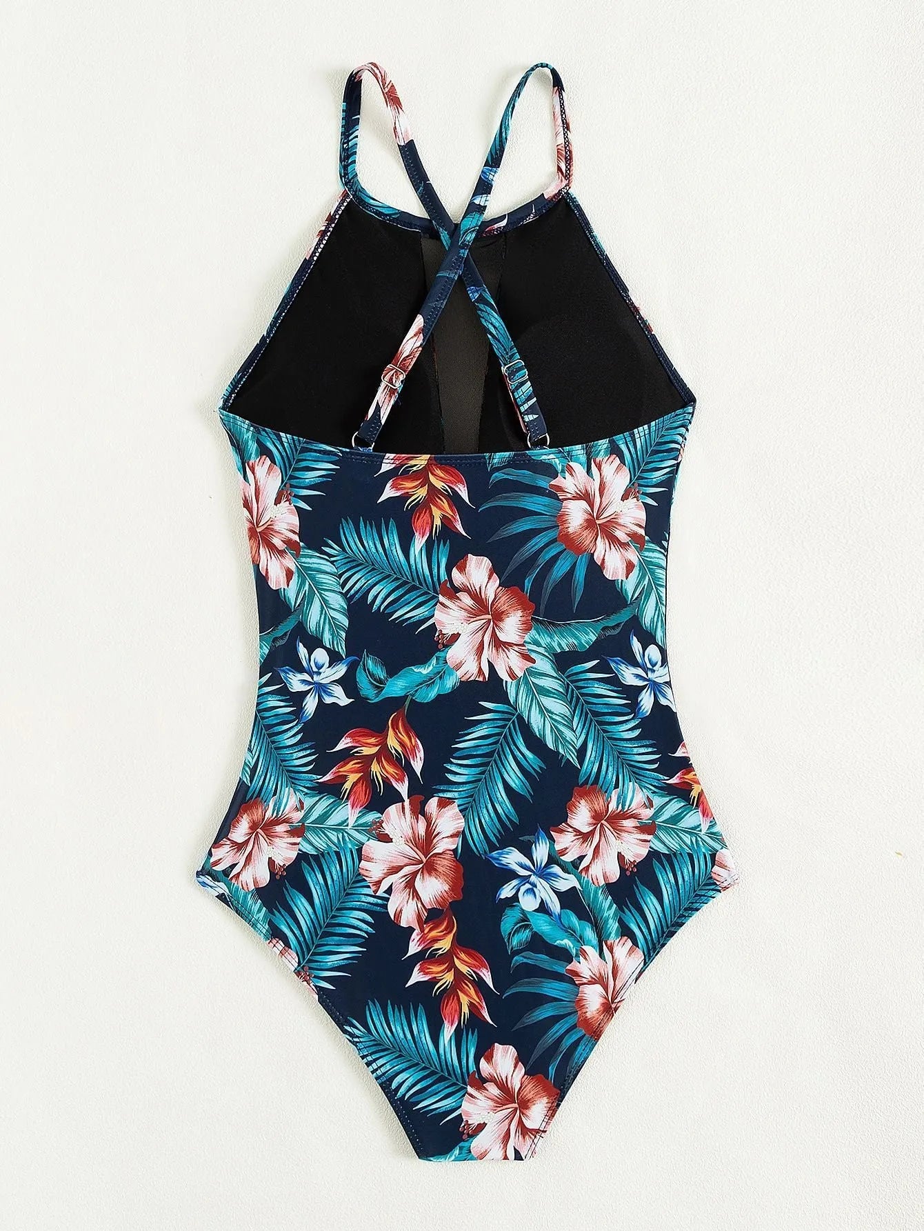 Women's printed one-piece swimsuit with deep V neckline on a mannequin, showing gradient colour design.